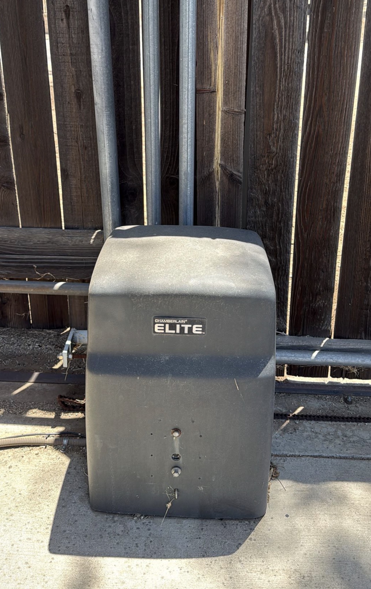 Chamberlain Elite automatic gate motor operator unit installed on a residential sliding gate